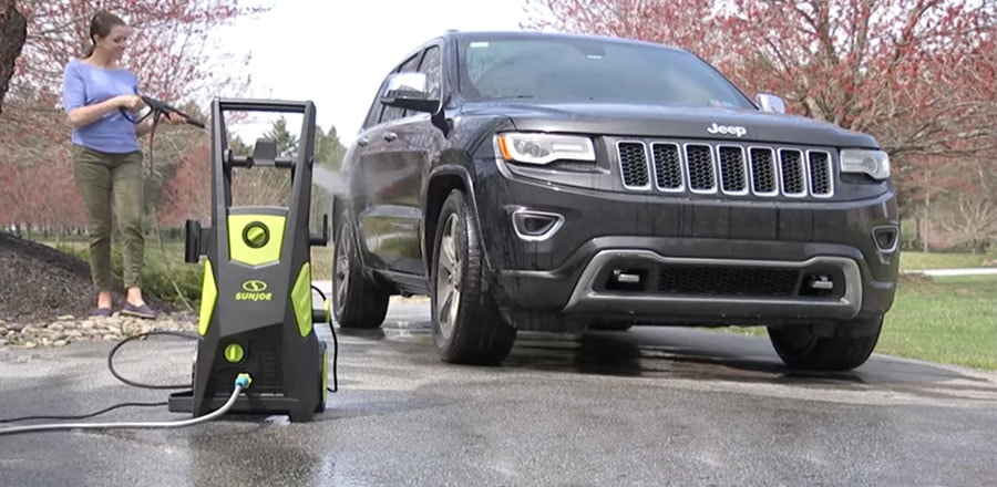 Woman washes her car using Sun Joe SPX3500.