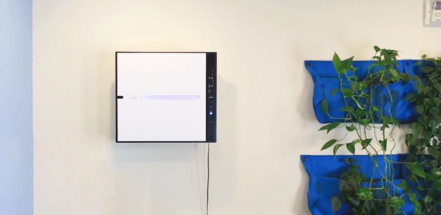 RabbitAir MinusA2 indoor air purifier hanging on the wall.