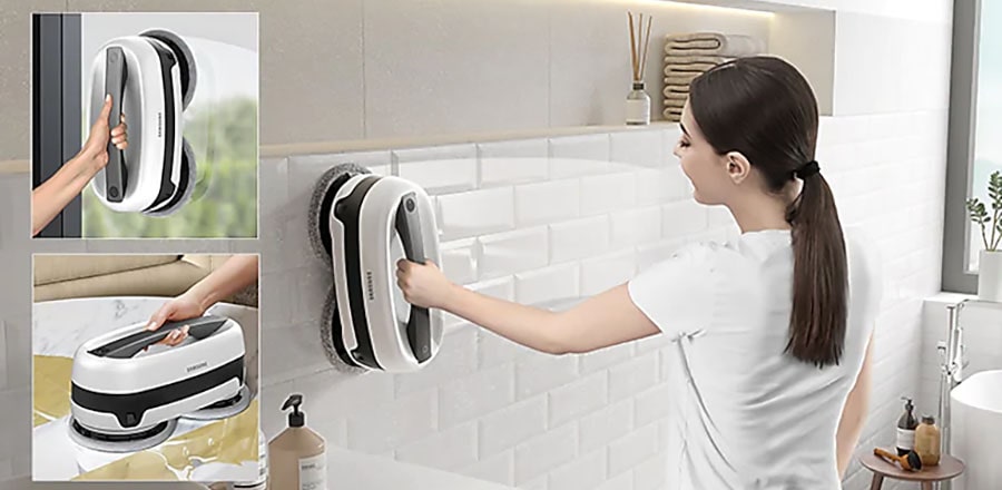 A woman uses Samsung Jetbot as an advanced handheld cleaner.