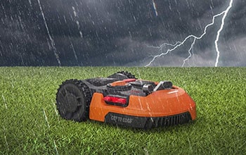 Weatherproof robot mowing your lawn.