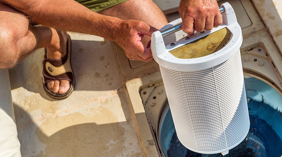 Man installs a pool filter.