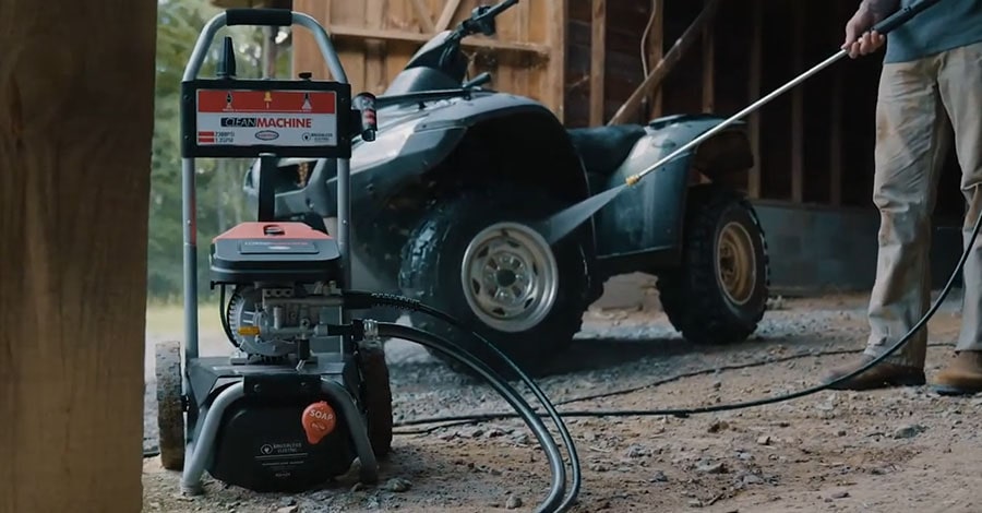 Man cleans his quad using Simpson CM61016.