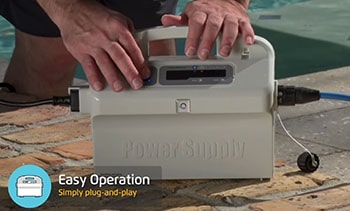 Owner of the Oasis Z5i starts cleaning process by pushing the button on the control unit of the robot