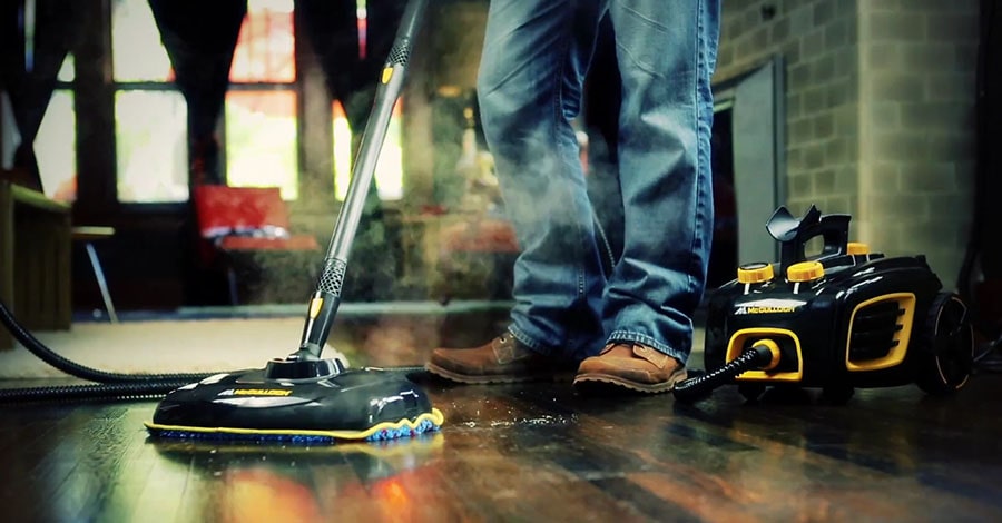 Man cleans hardwood floor with the McCulloch MC1375.