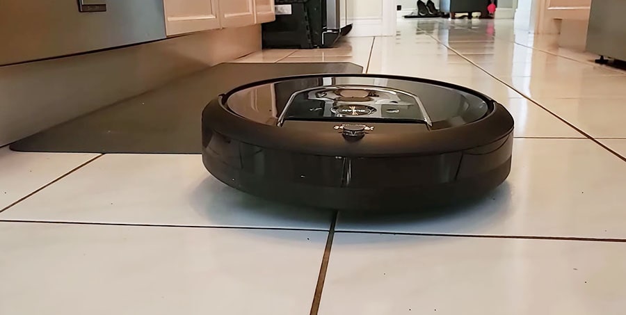 iRobot Roomba i7 vacuums the tiled floor.