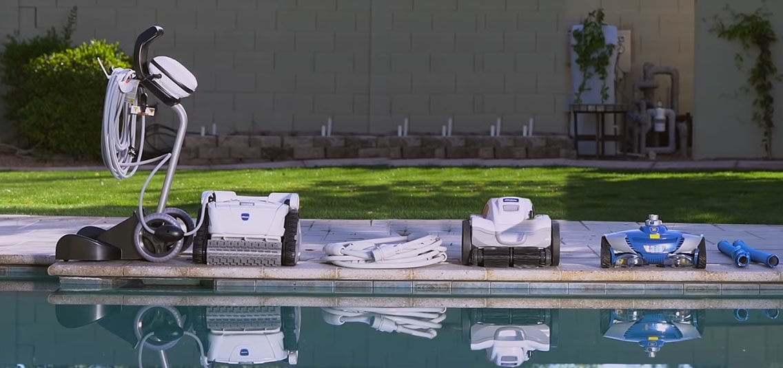 Iconic models of all major automatic pool cleaner types are standing near the pool