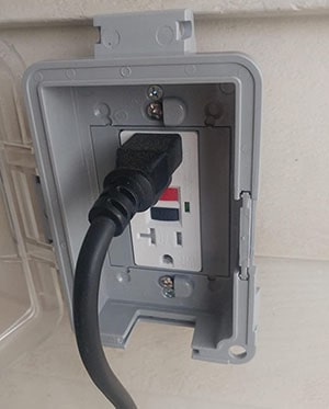 Weather-protected GFCI power outlet