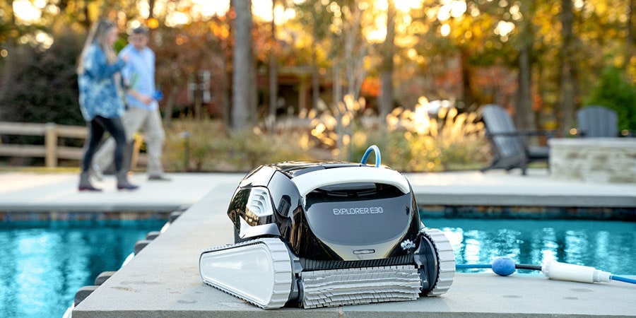 Robotic cleaner Explorer E30 standing near the pool after finishing its cleaning job.