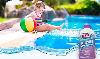 Pool water flocculant bottle and a kid sitting on the edge of the swimming pool