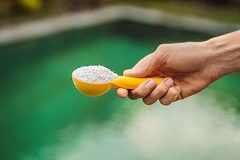 Chlorine powder in the spoon.