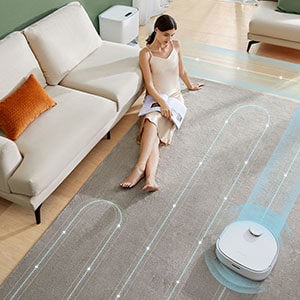 Dreametech W10 changes its cleaning path to avoid collision with a young woman sitting on the floor