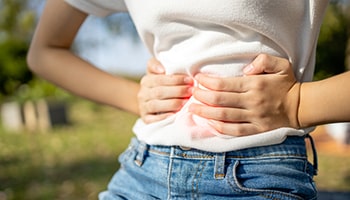 Woman has stomach cramps because of Shigella, swimming disease