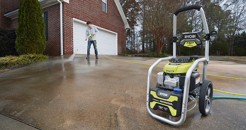 The Ryobi RY80942 3300 PSI near the garage