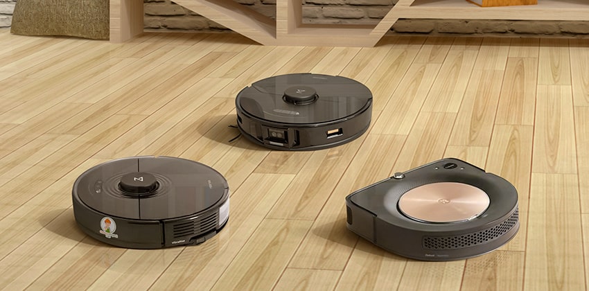 Top rated robot vacuums on the floor.