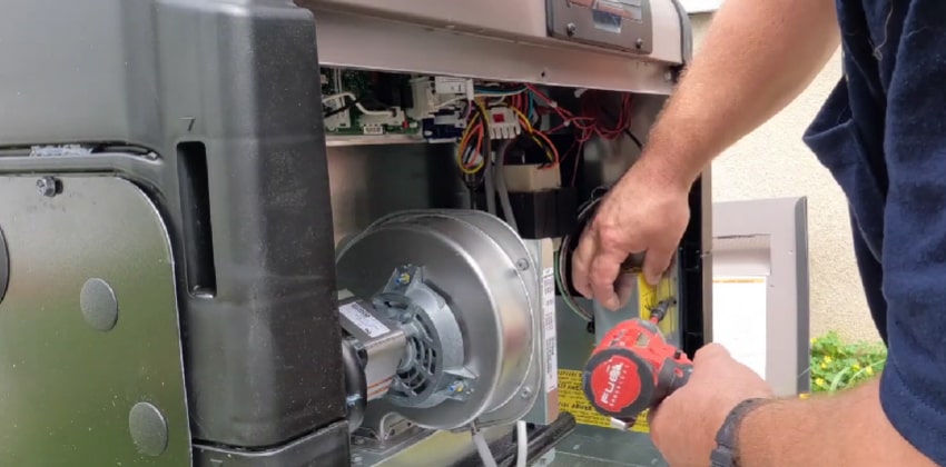 Man installing gas pool heater